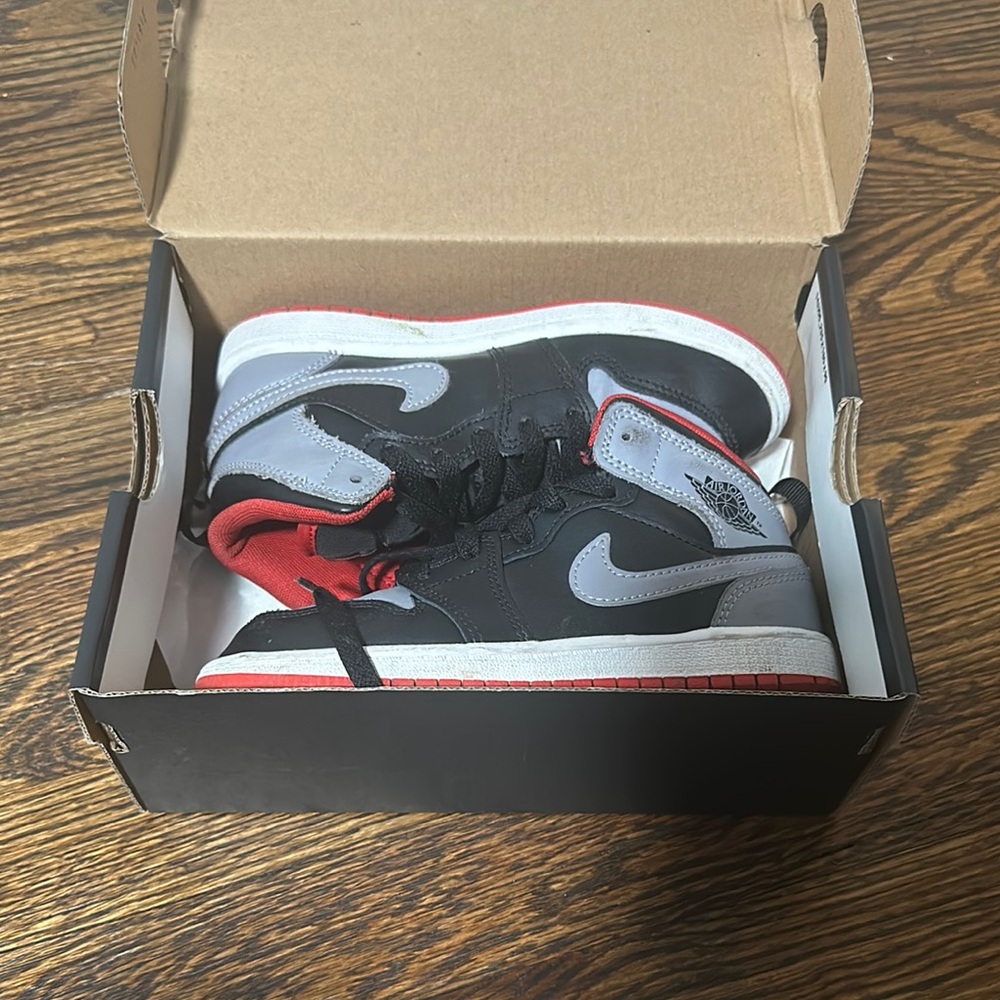 Kids Black and Fire Red Jordan 1s